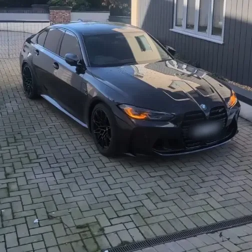 A black BMW G80 M3 Competition